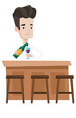 Image showing Bartender standing at the bar counter.