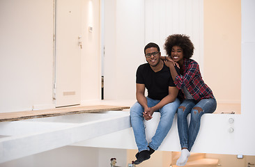 Image showing couple having break during moving to new house