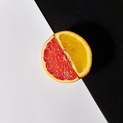 Image showing Grapefruit and orange citrus fruit halves