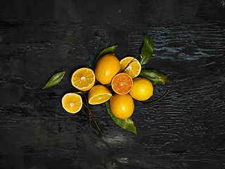 Image showing The fresh lemons on black background