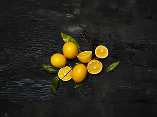 Image showing The fresh lemons on black background
