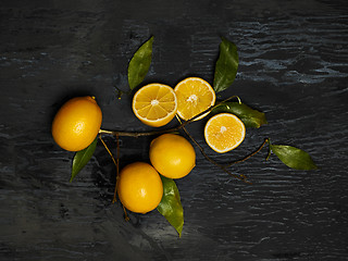 Image showing The fresh lemons on black background