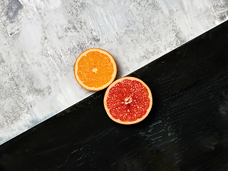 Image showing Grapefruit citrus fruit halves on wooden