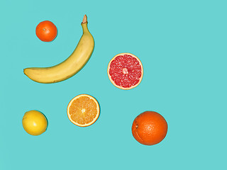 Image showing The group of banana and fresh fruits against blue background