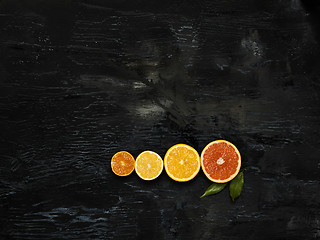 Image showing The group fresh fruits against black background