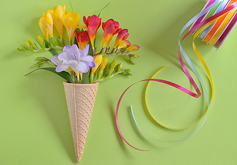 Image showing Freesias flowers in ice cream waffles