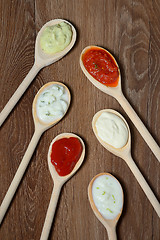 Image showing different types of sauces in spoons