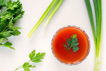 Image showing Tomato juice and greens, top view