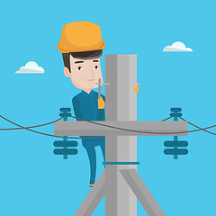 Image showing Electrician working on electric power pole.
