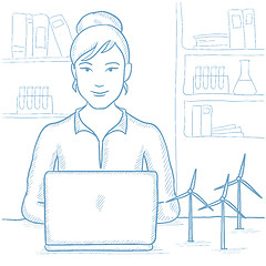 Image showing Woman working with model wind turbines on table.