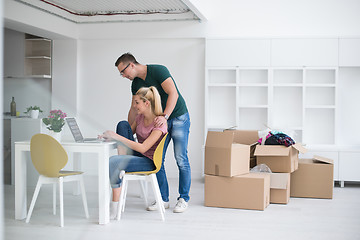 Image showing Young couple moving in a new home