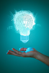 Image showing Hands of business person holding illuminated light bulb sign