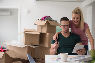 Image showing Young couple moving in a new home