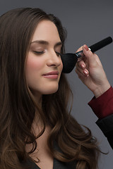 Image showing professional makeup artist working