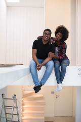 Image showing couple having break during moving to new house