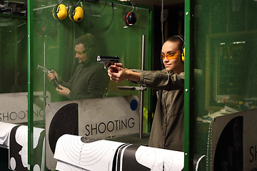 Image showing Relax on the shooting, a woman shot with a Glock.