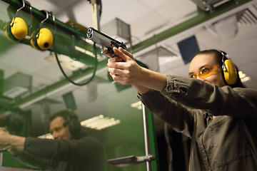 Image showing Relax on the shooting, a woman shot with a Glock.