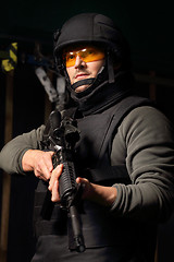 Image showing Military exercises on the firing range The soldier fires a rifle at the shooting range Cop shoots a rifle shooting range