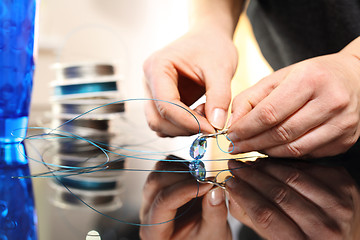 Image showing Jewelry, atelier jewelery Jeweler, goldsmith while working on silver jewelry