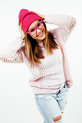 Image showing young pretty teenage hipster girl posing emotional happy smiling on white background, lifestyle people concept 