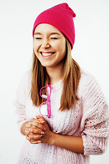 Image showing young pretty teenage hipster girl posing emotional happy smiling on white background, lifestyle people concept 