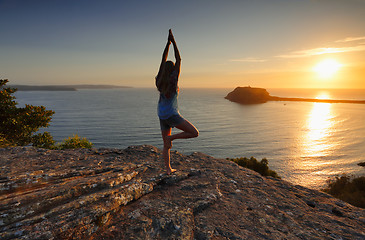 Image showing Yoga by the Sea at sunrise - Tree Pose Vrksasana