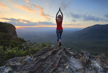 Image showing Female fitness stretch to the sky mountain top valley scene