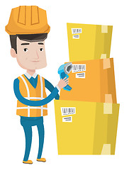 Image showing Warehouse worker scanning barcode on box.