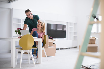 Image showing Young couple moving in a new home