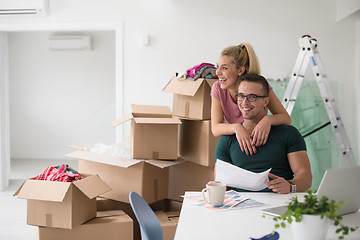 Image showing Young couple moving in a new home