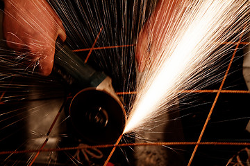 Image showing Electric grinder - sparks flying