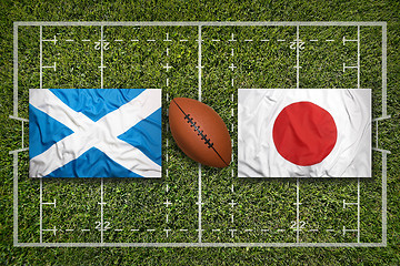 Image showing Scotland vs. Japan flags on rugby field