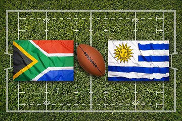 Image showing South Africa vs. Uruguay flags on rugby field