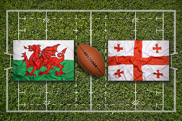 Image showing Wales vs. Georgia flags on rugby field