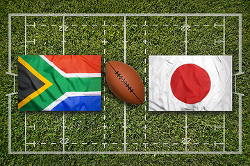 Image showing South Africa vs. Japan flags on rugby field