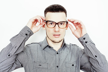 Image showing young handsome well-groomed guy posing emotional on white background, lifestyle people concept