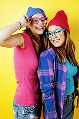 Image showing lifestyle people concept: two pretty stylish modern hipster teen girl having fun together, happy smiling making selfie