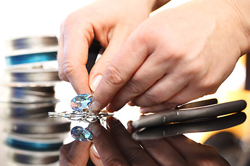 Image showing Jeweler creates jewelry