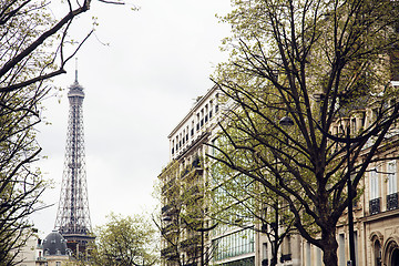 Image showing french paris street with Eiffel Tower in perspective trought trees, post card view