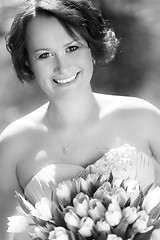 Image showing Happy bride with wedding bouquet.