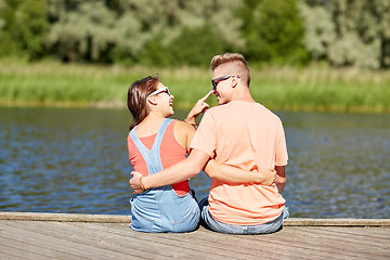 Image showing happy teenage couple hugging on river summer berth