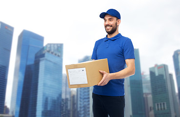 Image showing happy delivery man with parcel box