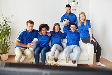 Image showing friends or football fans watching soccer at home