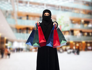 Image showing muslim woman in hijab with shopping bags