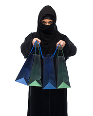 Image showing muslim woman in hijab with shopping bags