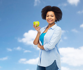 Image showing happy african american woman with green apple