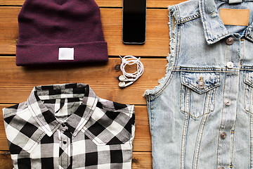 Image showing clothes and smartphone with earphones