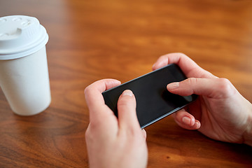 Image showing close up of woman with smartphone and coffee