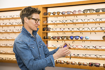 Image showing woman in a eyewear store