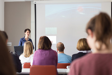 Image showing Woman giving presentation in lecture hall at university.